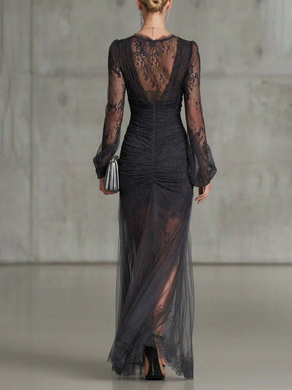 Quintina | Long black dress with deep V-neck and dramatic slit